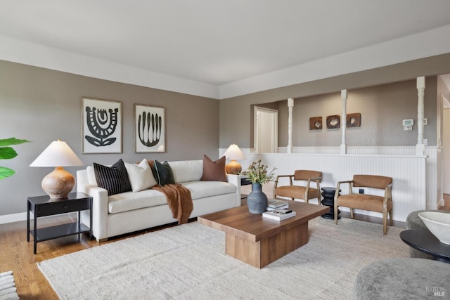 living room featuring wood finished floors and baseboards