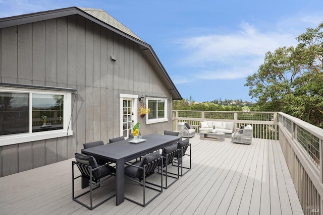 deck with an outdoor hangout area and outdoor dining space