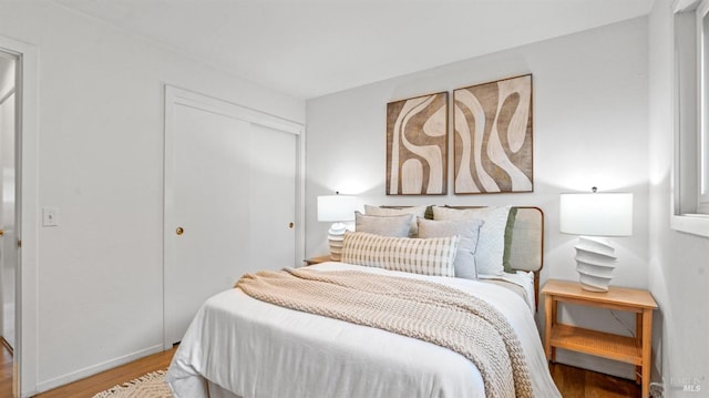 bedroom featuring a closet and wood finished floors