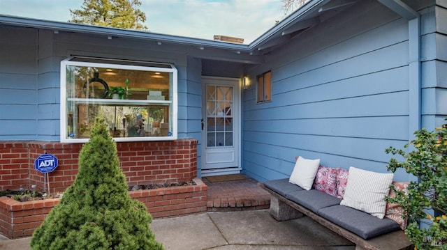 property entrance with brick siding