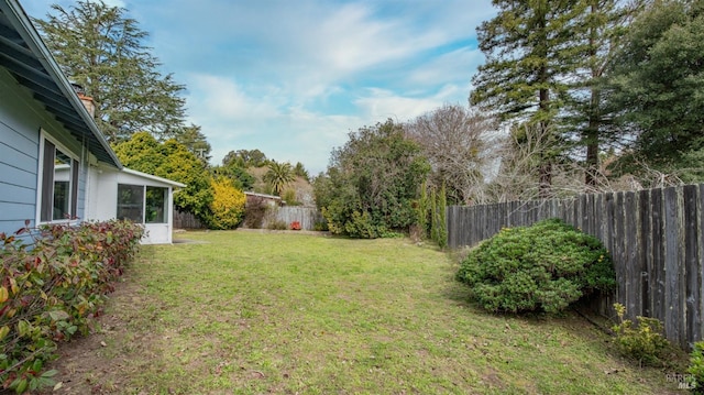 view of yard with a fenced backyard