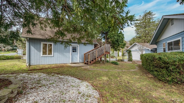 view of yard with an outdoor structure and stairs