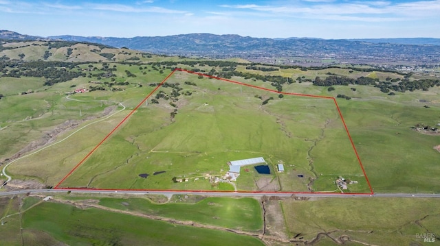 bird's eye view with a mountain view and a rural view