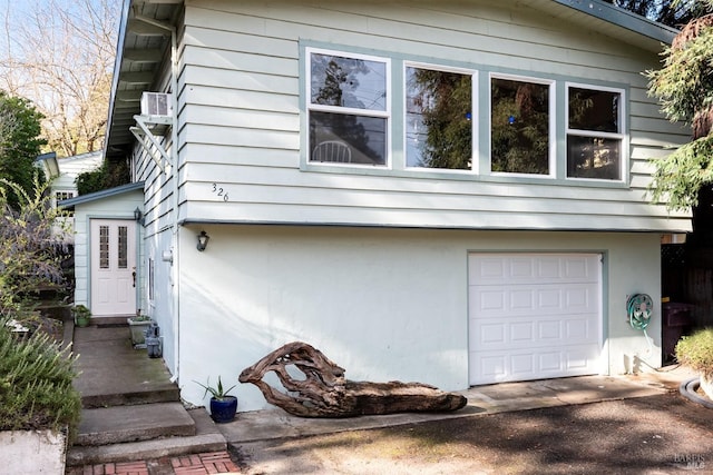 view of side of property with a garage