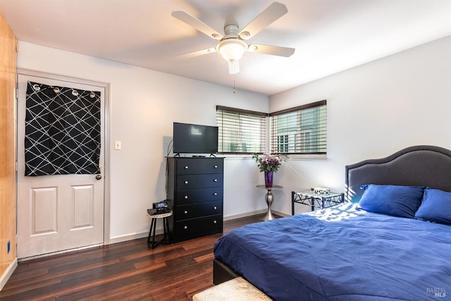 bedroom with wood finished floors and baseboards