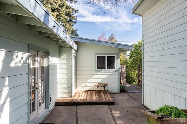 view of side of property featuring french doors and a patio