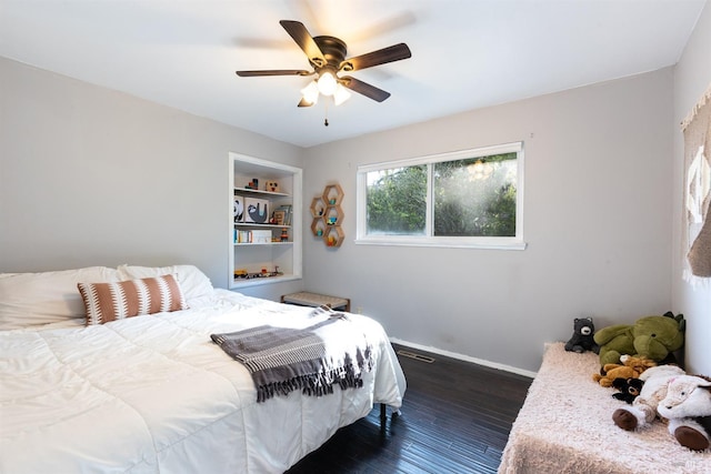 bedroom with dark wood-style floors, baseboards, and a ceiling fan