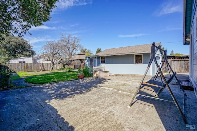 exterior space featuring a yard, a fenced backyard, and a patio