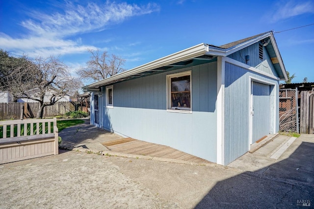 view of home's exterior featuring fence