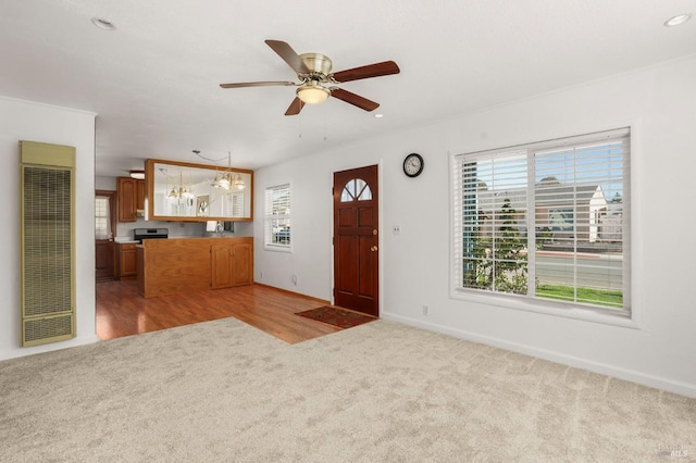 entrance foyer with ceiling fan, recessed lighting, light colored carpet, baseboards, and a heating unit