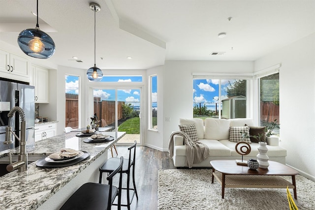 sunroom / solarium featuring visible vents