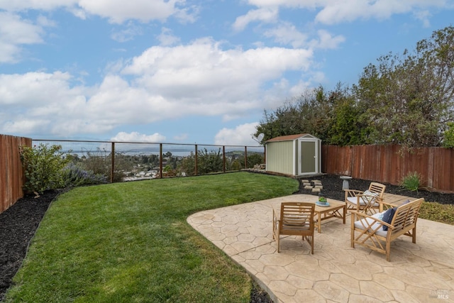 view of yard featuring a fenced backyard, a shed, and a patio