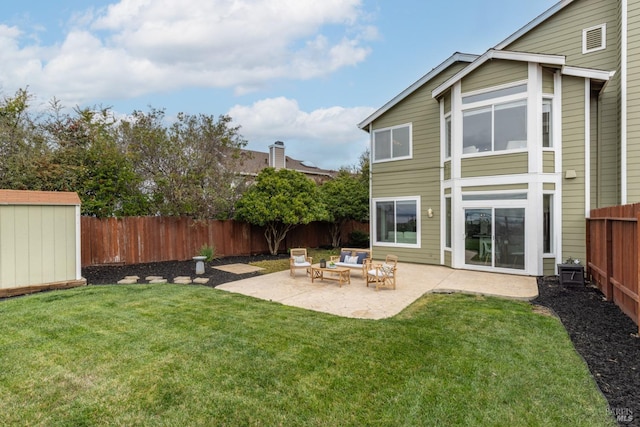 exterior space with an outbuilding, a patio, a fenced backyard, a storage shed, and a lawn