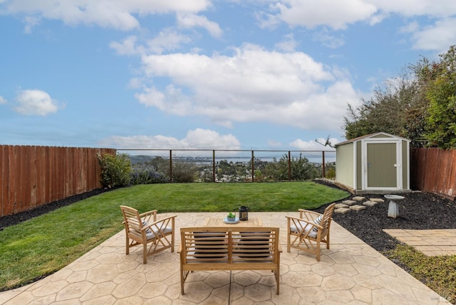 view of patio / terrace featuring a shed, an outdoor structure, and a fenced backyard