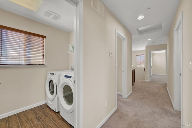 laundry room featuring attic access, visible vents, baseboards, and independent washer and dryer