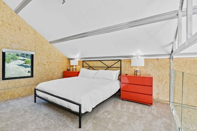 carpeted bedroom with lofted ceiling