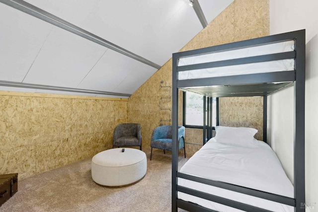 bedroom with carpet flooring and vaulted ceiling