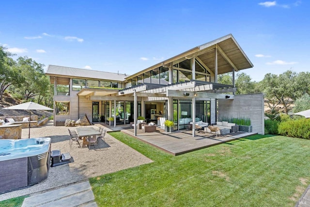 back of house with an outdoor hangout area, a lawn, a wooden deck, and a pergola