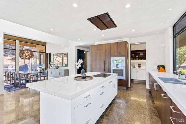 kitchen with modern cabinets, light countertops, and recessed lighting