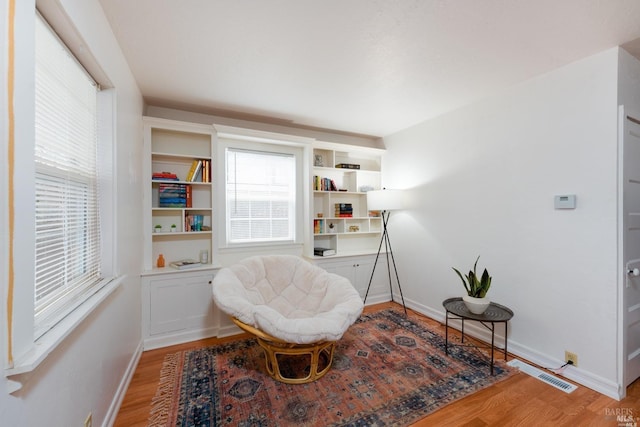 sitting room featuring light wood-style floors and baseboards