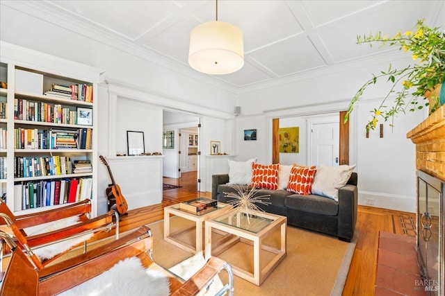 living room with baseboards, coffered ceiling, wood finished floors, and crown molding