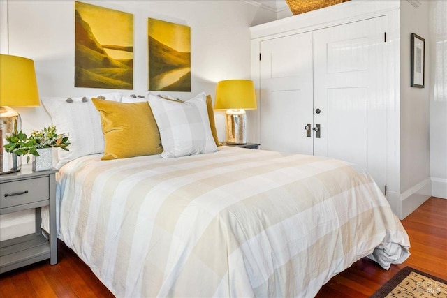 bedroom with a closet and wood finished floors