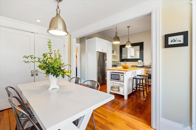 dining room featuring dark wood-style floors