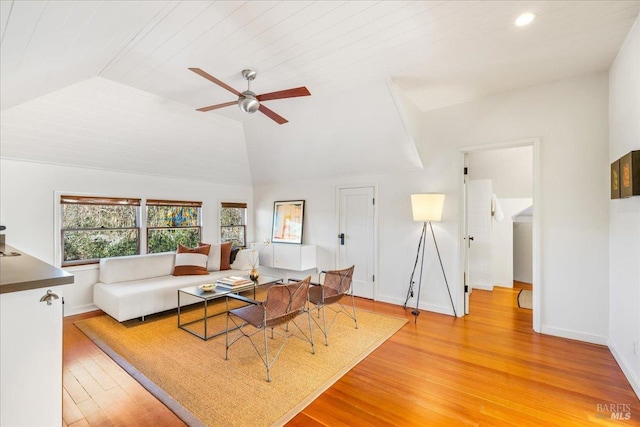 living room with ceiling fan, recessed lighting, baseboards, vaulted ceiling, and light wood finished floors