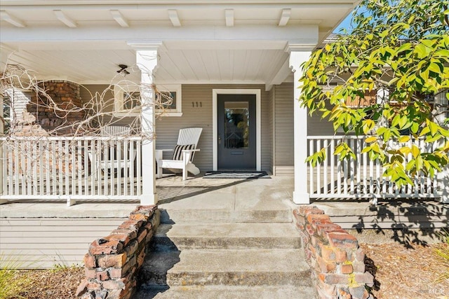 property entrance featuring covered porch