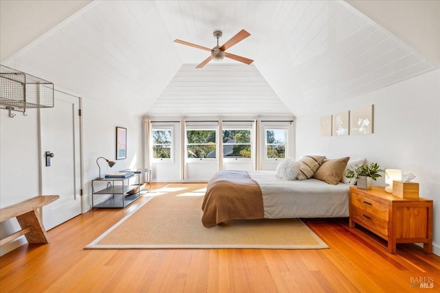 bedroom with light wood-type flooring, wooden ceiling, ceiling fan, and lofted ceiling