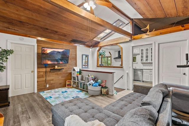 playroom with lofted ceiling with beams, wooden walls, and wood finished floors