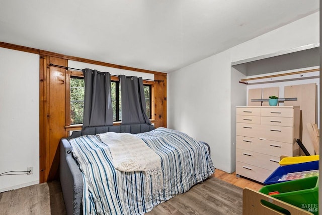 bedroom featuring wood finished floors