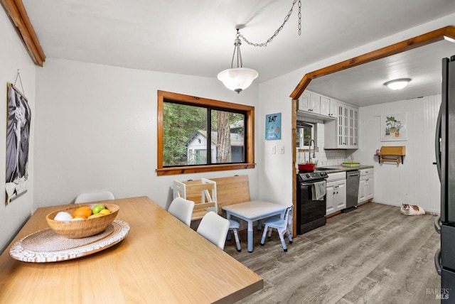 dining area with light wood-type flooring