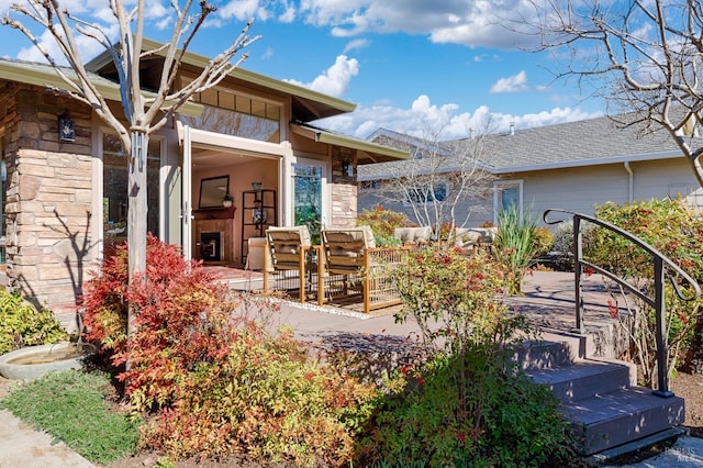 exterior space featuring stone siding