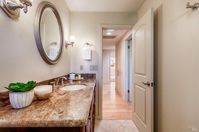 bathroom featuring visible vents, tile patterned flooring, and vanity