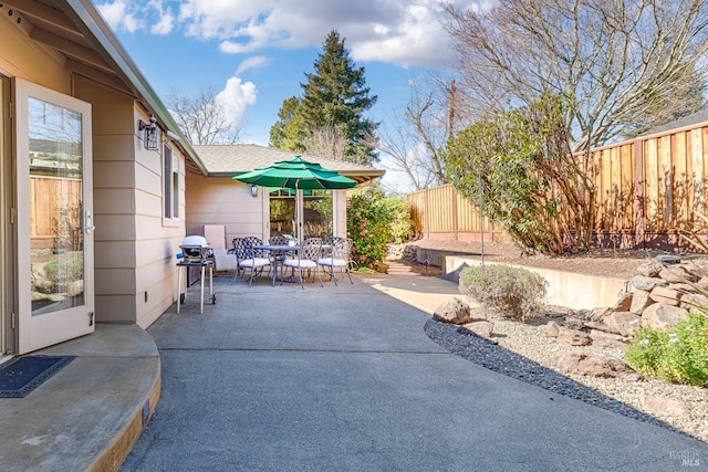 view of patio featuring outdoor dining area and a fenced backyard