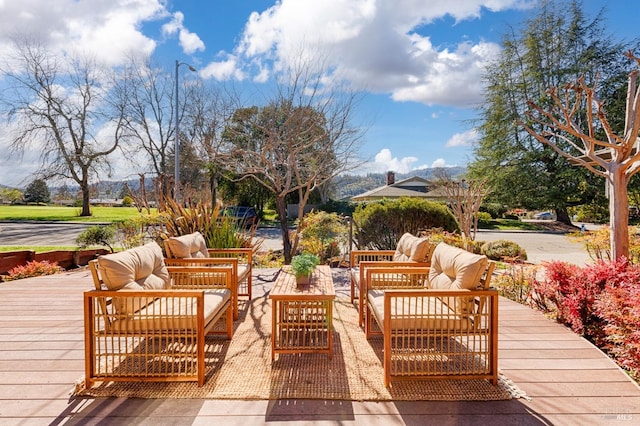 wooden deck with an outdoor hangout area