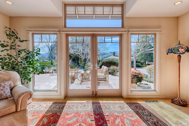 doorway featuring recessed lighting, french doors, and wood finished floors