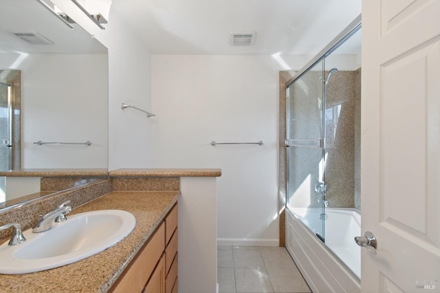 full bathroom featuring visible vents, enclosed tub / shower combo, vanity, tile patterned flooring, and baseboards