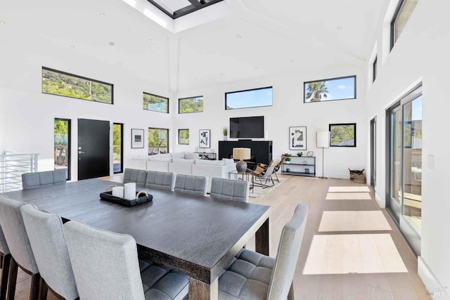 dining area featuring recessed lighting, plenty of natural light, and wood finished floors