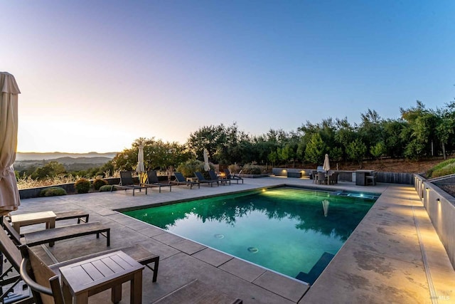 outdoor pool featuring a patio