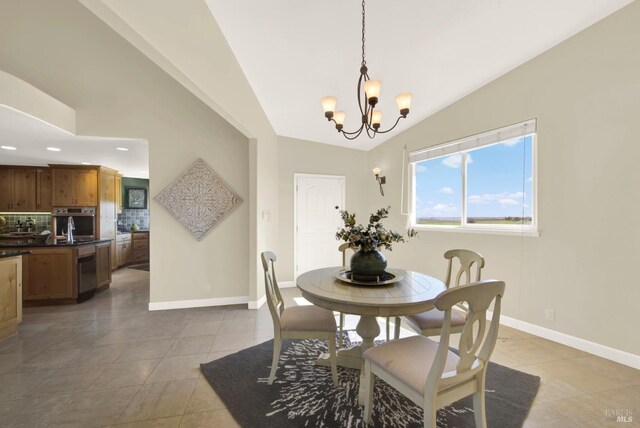 dining room featuring lofted ceiling, light tile patterned floors, a chandelier, recessed lighting, and baseboards