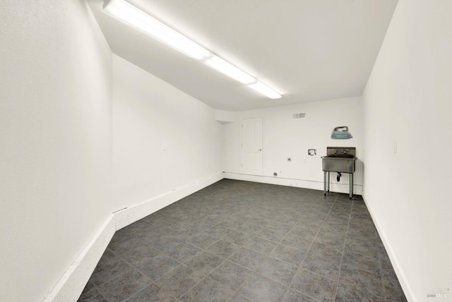 empty room with visible vents and baseboards