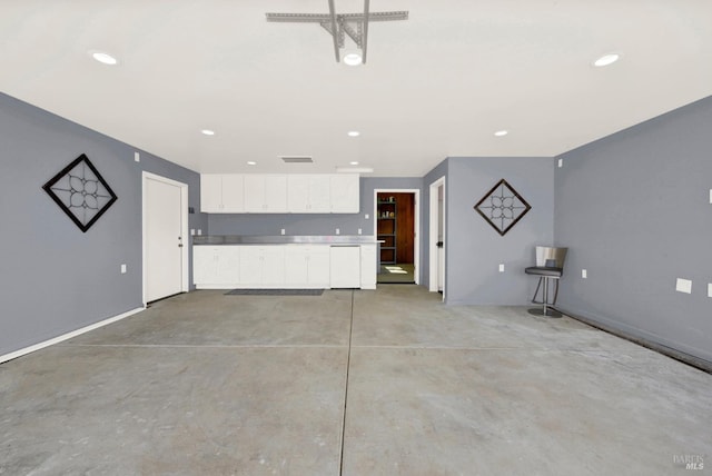 unfurnished living room with baseboards, concrete floors, visible vents, and recessed lighting