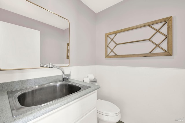 half bath with vanity and toilet