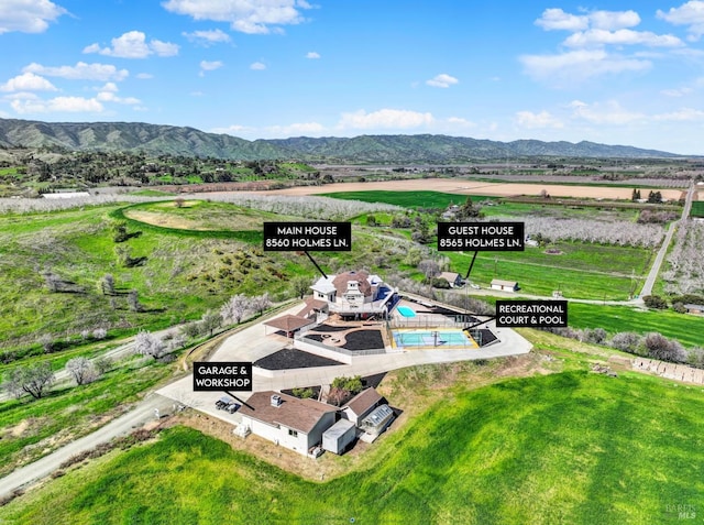 drone / aerial view with a rural view and a mountain view