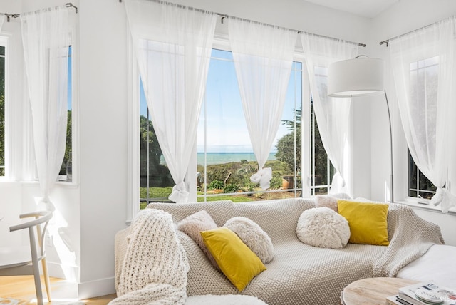 sitting room featuring a water view