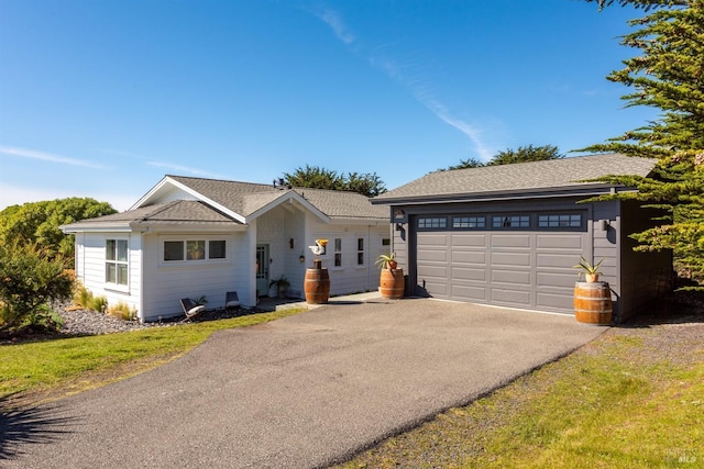 ranch-style house featuring a garage