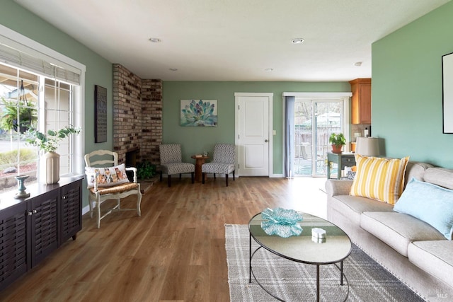 living room with baseboards and light wood-type flooring