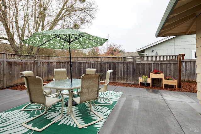 view of patio / terrace with outdoor dining area and a fenced backyard